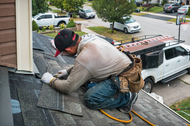 Professional Roofing technician working in Medford, NY